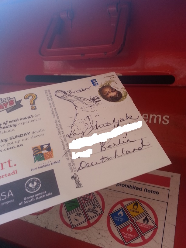 A photo of a big, throbbing penis drawn on a postcard... being sent from Australia to Germany.
