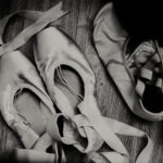 Black and white photograph demi-pointe shoes on left, MDM flats on the right.