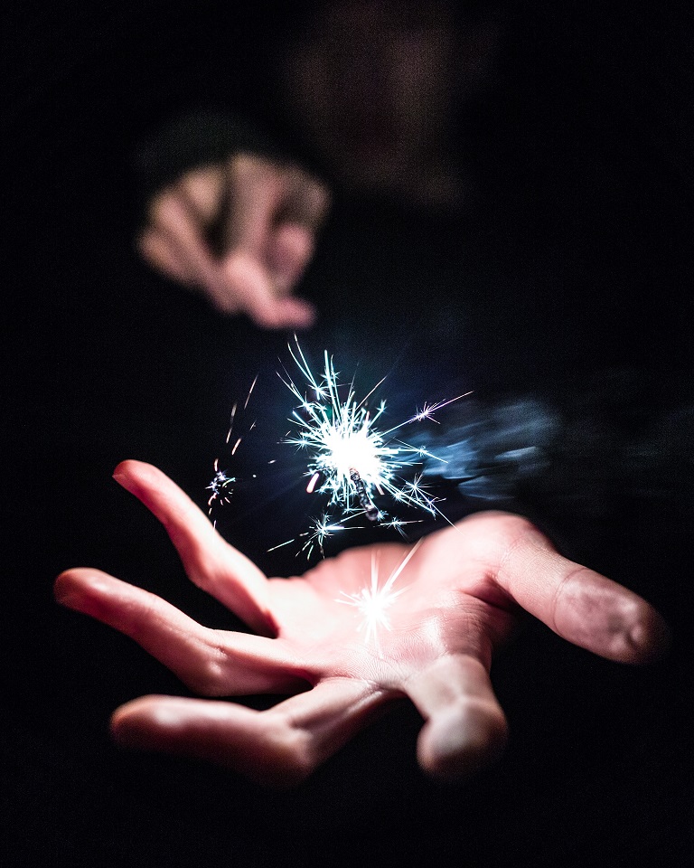 hand with a spark